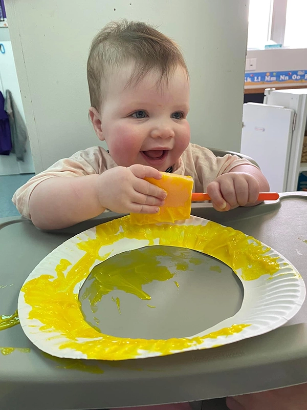 Toddler painting at Scribbletime